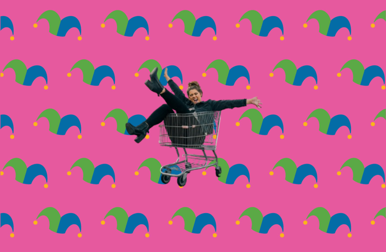 A shopping cart with a person having fun laying inside it