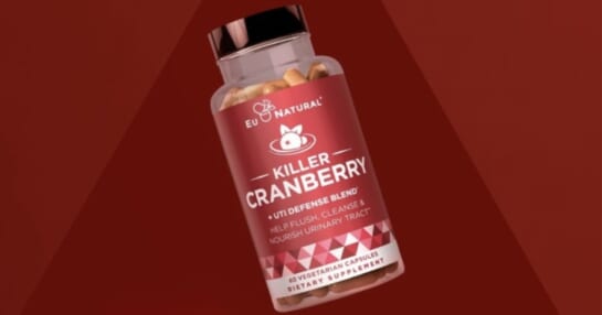 bottle of Killer Cranberry supplements on a dark red background